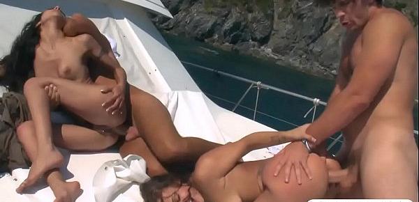  Two stunning babes anal orgy with nasty men in a boat